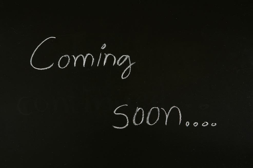 word 'coming soon' on blackboard